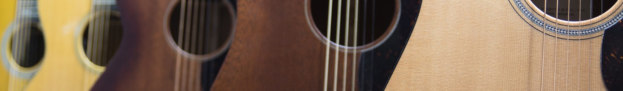 Header-Images Closeup of guitars on display