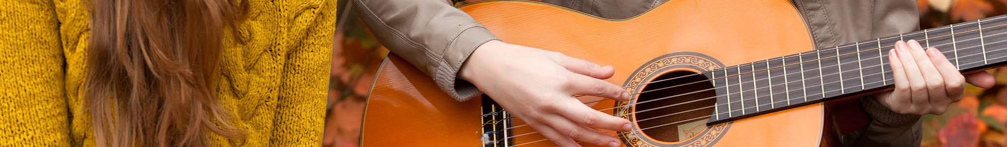 Student playing the guitar