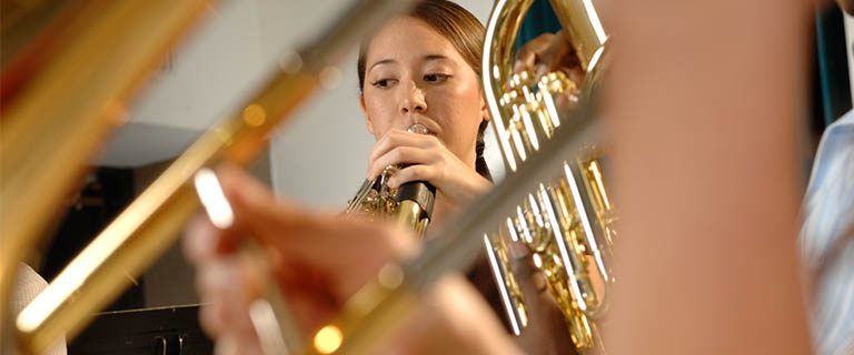 Gently Used Instruments Students playing a brass instrument