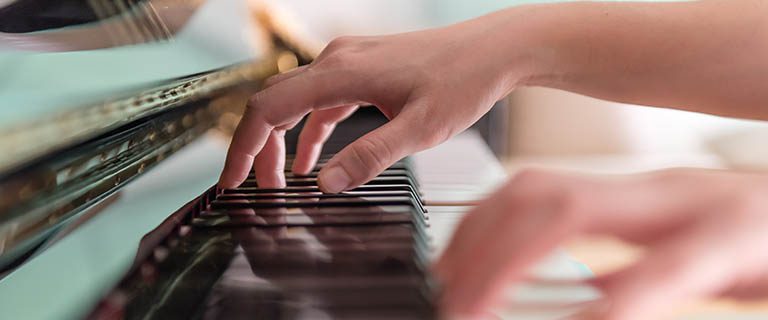 Student playing the piano